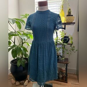 Vintage inspired Lace Mini Dress in a grey-teal blue with a keyhole back. GUC SM